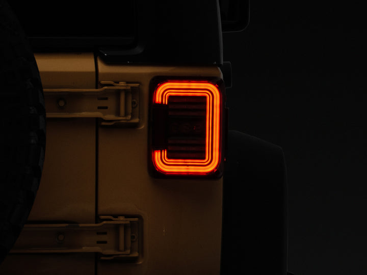 Raxiom 07-18 Jeep Wrangler JK Axial Series LED Halo Tail Lights- Black Housing (Dark Smoked Lens)